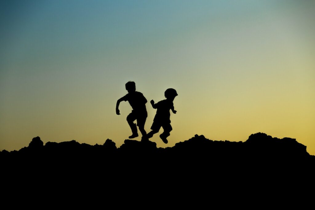 Silhouette Photo of Jumping Children